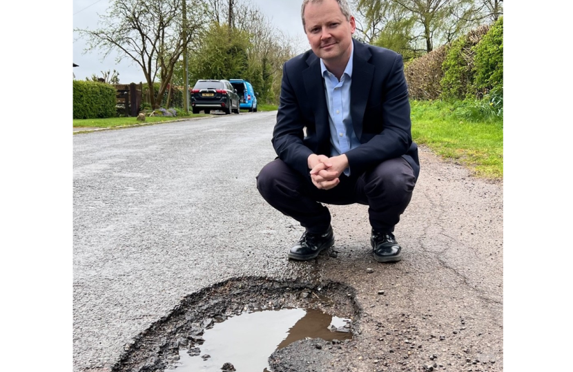 Neil with large pothole