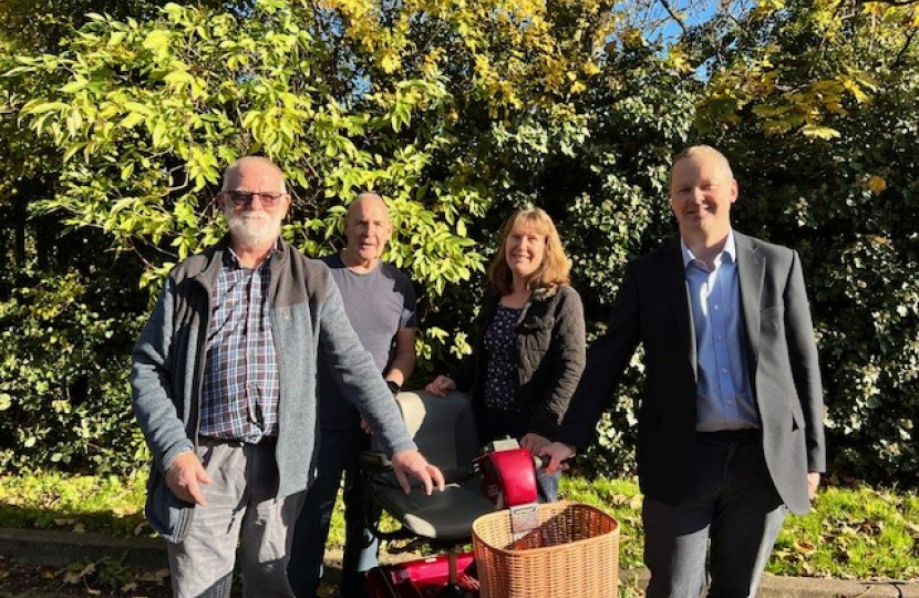 Neil with Shopmobility volunteers at Roman Way