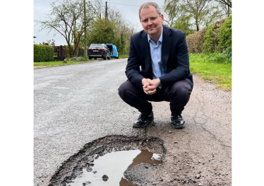 Neil with large pothole