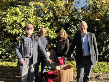 Neil O'Brien with Shopmobility volunteers