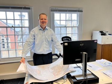 Neil O'Brien with a map